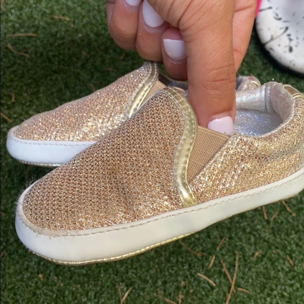 Stuart Weitzman gold shimmer slip ons